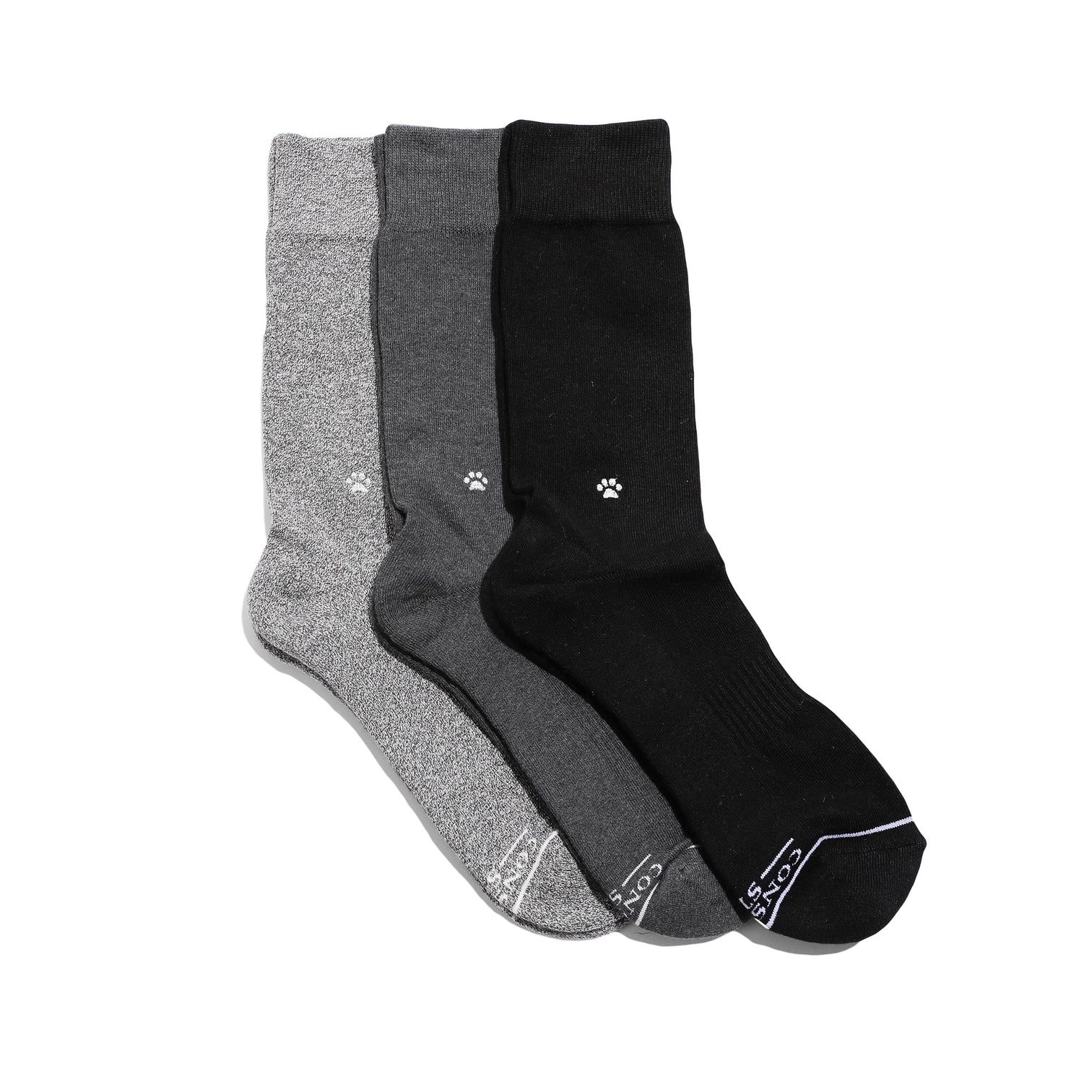 Three pairs of socks with embroidered white paw prints on them