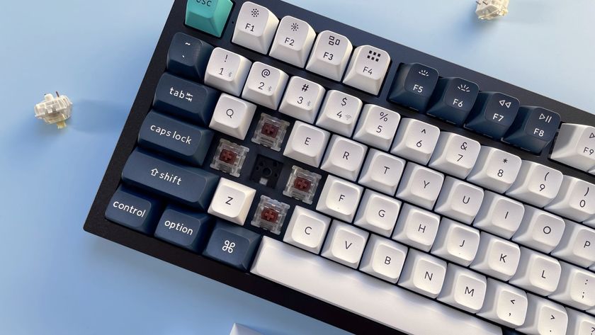 The Keychron Q6 Max mechanical keyboard against a blue background.