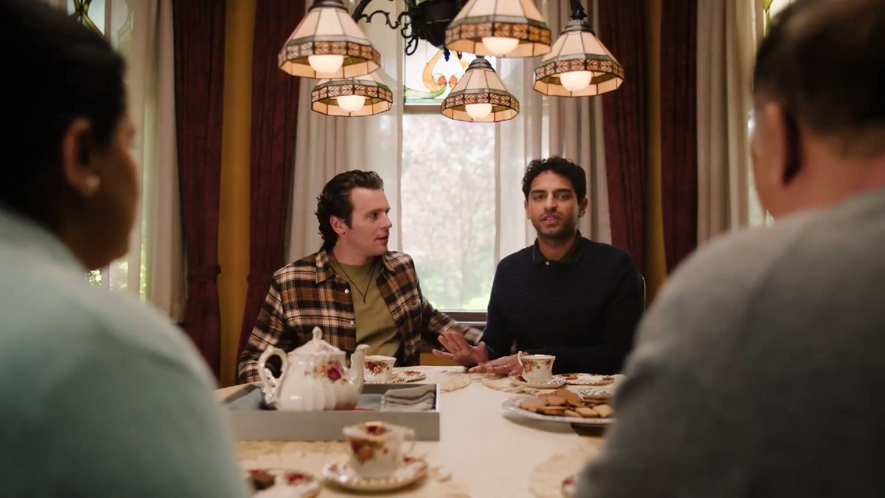 Jonathan Groff looks at Karan Soni, while he looks at Zarna Garg and Harish Patel in A Nice Indian Boy.