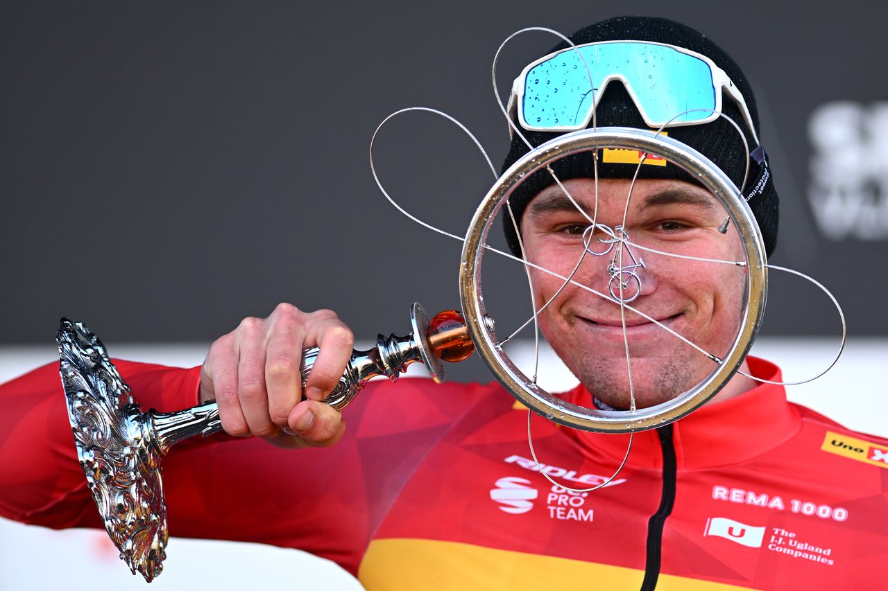 Søren Wærenskjold celebrates on the podium with the winner&#039;s trophy