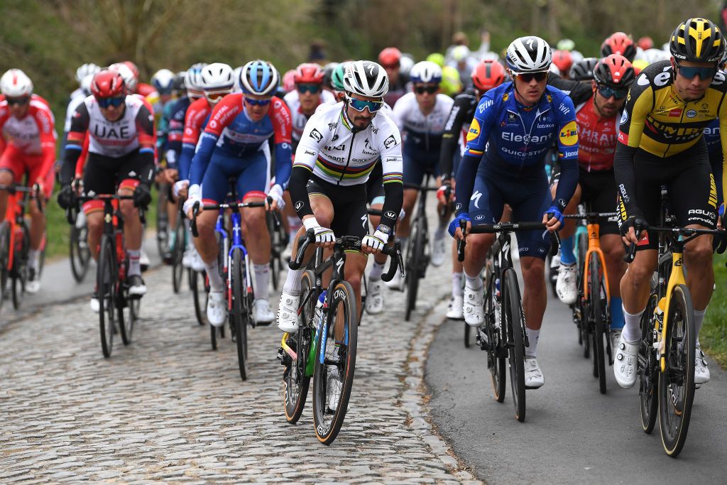 OUDENAARDE BELGIUM APRIL 04 Julian Alaphilippe of France Yves Lampaert of Belgium and Team Deceuninck QuickStep Wout Van Aert of Belgium and Team Jumbo Visma during the 105th Ronde van Vlaanderen Tour of Flanders 2021 Mens Elite a 2515km race from Antwerp to Oudenaarde Kortekeer Cobblestones sector RVV21 rondevanvlaanderen tourofflanders on April 04 2021 in Oudenaarde Belgium Photo by Tim de WaeleGetty Images