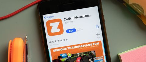a photo of a phone with the Zwift running app 