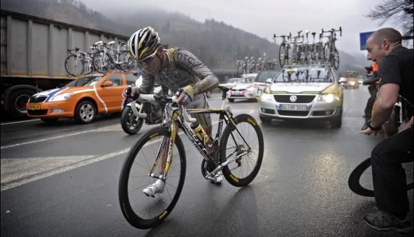 Defending Milan-San Remo champion Mark Cavendish (HTC-Columbia) remounts after suffering a mechanical problem