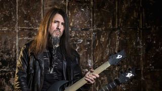 Ron 'Bumblefoot' Thal holding a twin-neck guitar