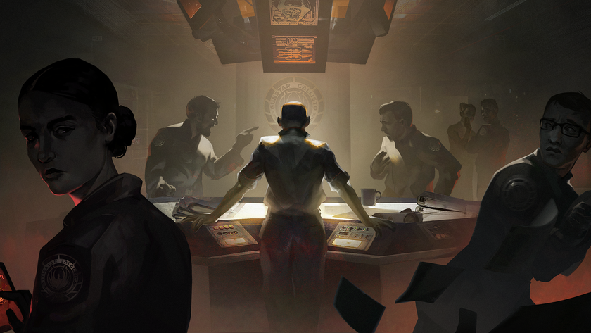 People standing around a table in a dimly lit room