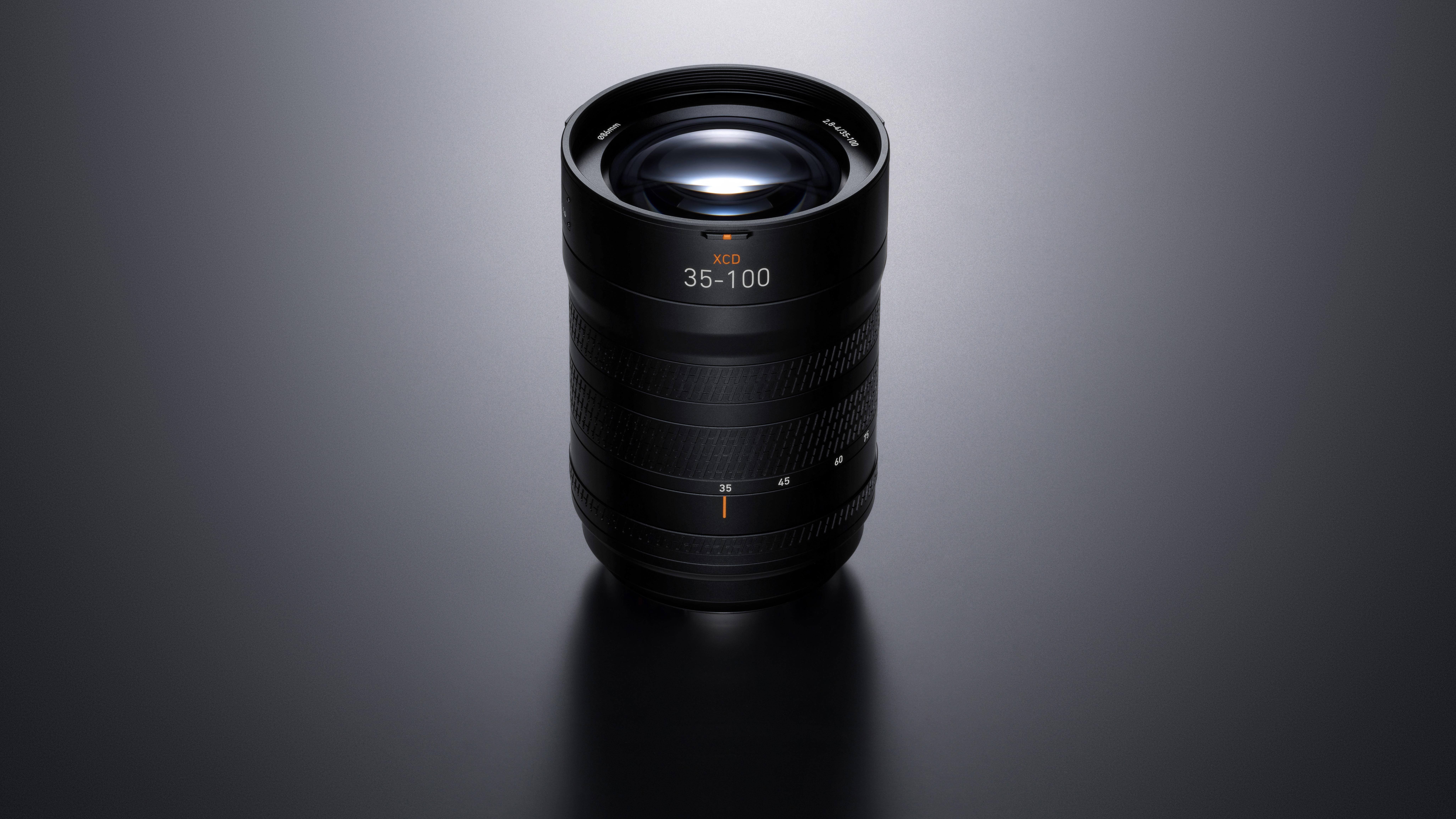 Hasselblad XCD 35-100E, moodily lit, against a grey background