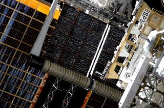 A new International Space Station (ISS) Roll-Out Solar Array (iROSA) is seen unfurling after NASA astronauts Josh Cassada and Frank Rubio installed it in place during a spacewalk on Saturday, Dec. 3, 2022.
