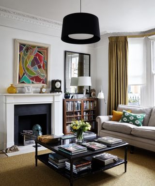 Living room ceiling light ideas with large black lampshade on a pendant light