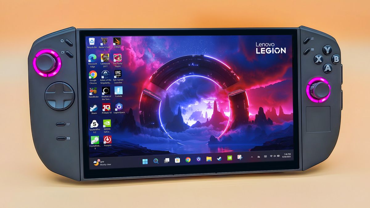 The Lenovo Legion Go 2 standing upright with controller attached. The RGB lighting area around the joysticks glow pink.