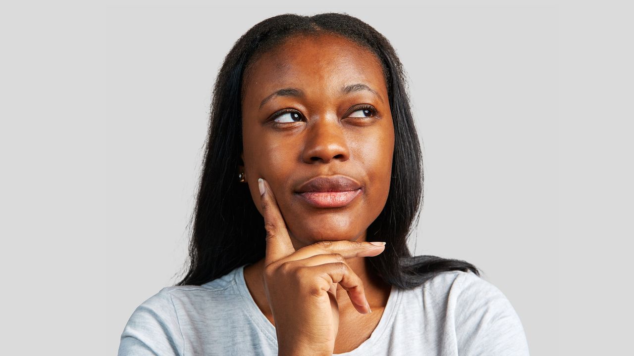 A woman seems to consider her options, looking into the distance.