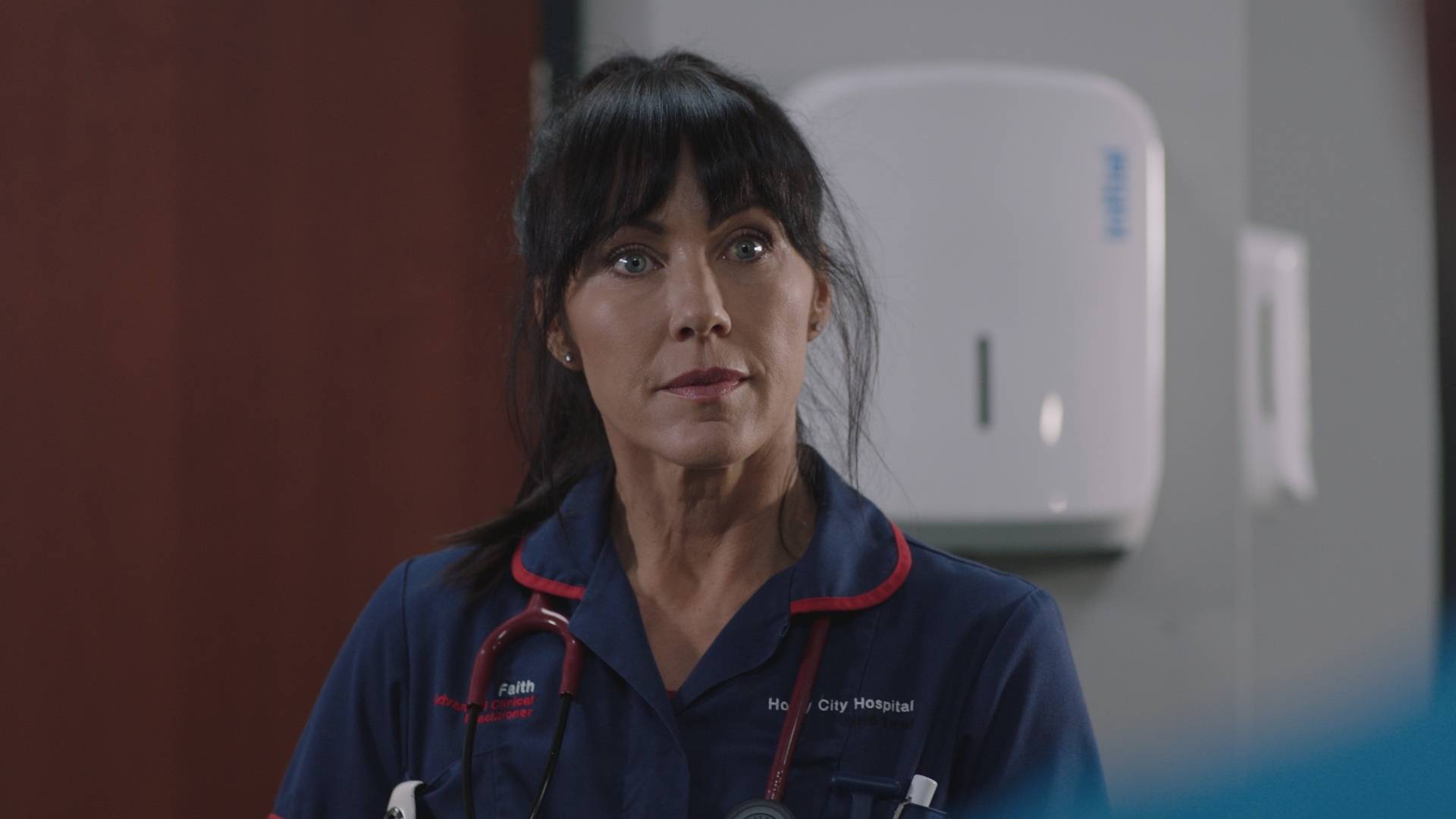 Faith at work looking stunned by the news regarding Iain.