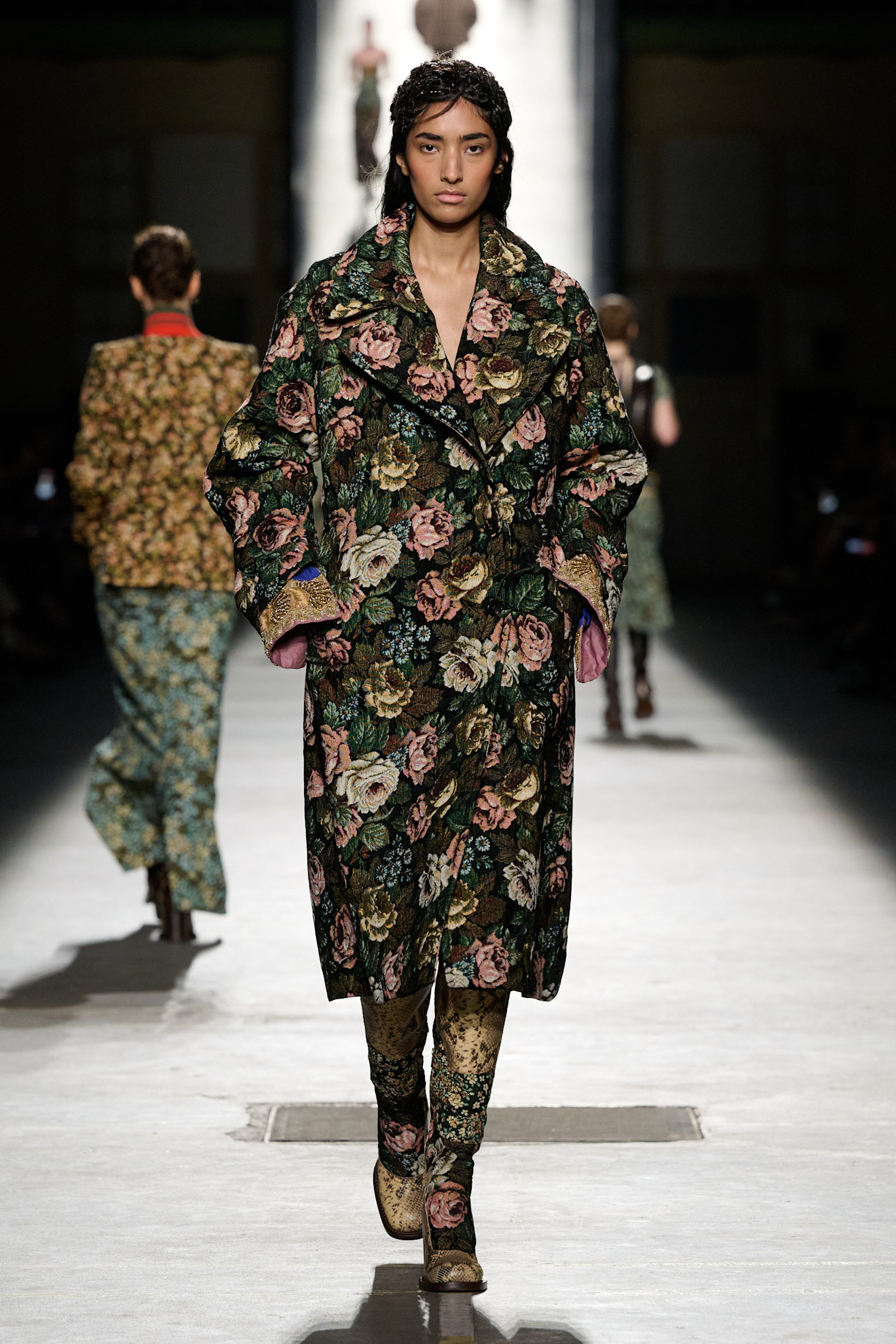 Dries Van Noten fall/winter 2026 model wearing moody floral-print clothing.