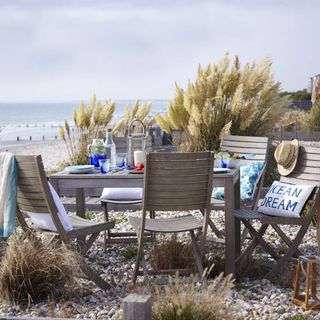 sea view with folding chairs and wooden table