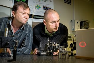 Vladlen Shvedov (L) and Cyril Hnatovsky adjust the hollow laser beam for their tractor beam experiment at the Australian National University.