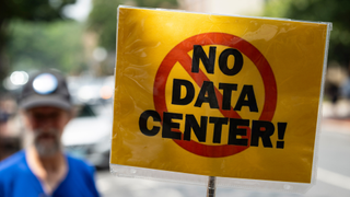 a 'No Data Center!' sign at a protest