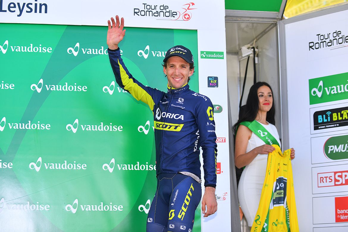 Simon Yates steps into the podium