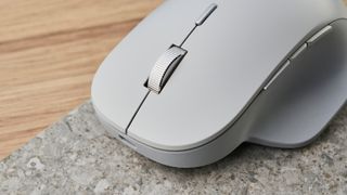 A white wireless Microsoft Surface Precision mouse