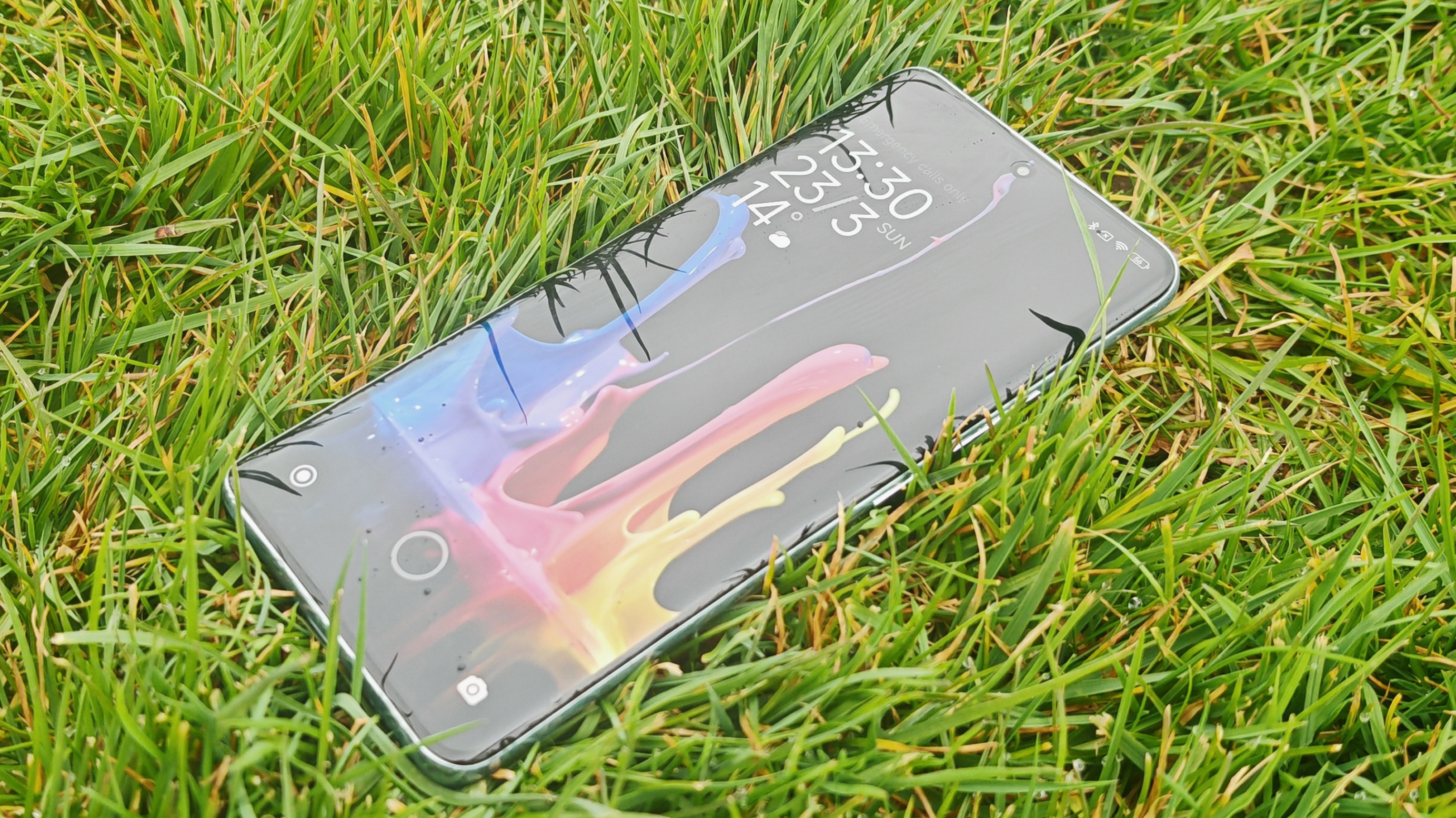 Xiaomi Redmi Note 14 Pro Plus 5G phone in hand and on grass showing homescreens and cameras up close