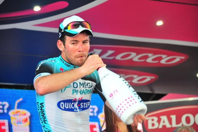 Mark Cavendish (Omega Pharma QuickStep) takes a drink on the podium