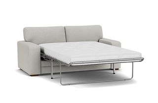 A pull-out sofa bed with the bed frame extended