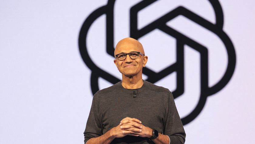 Microsoft CEO, Satya Nadella in front of the OpenAI logo.