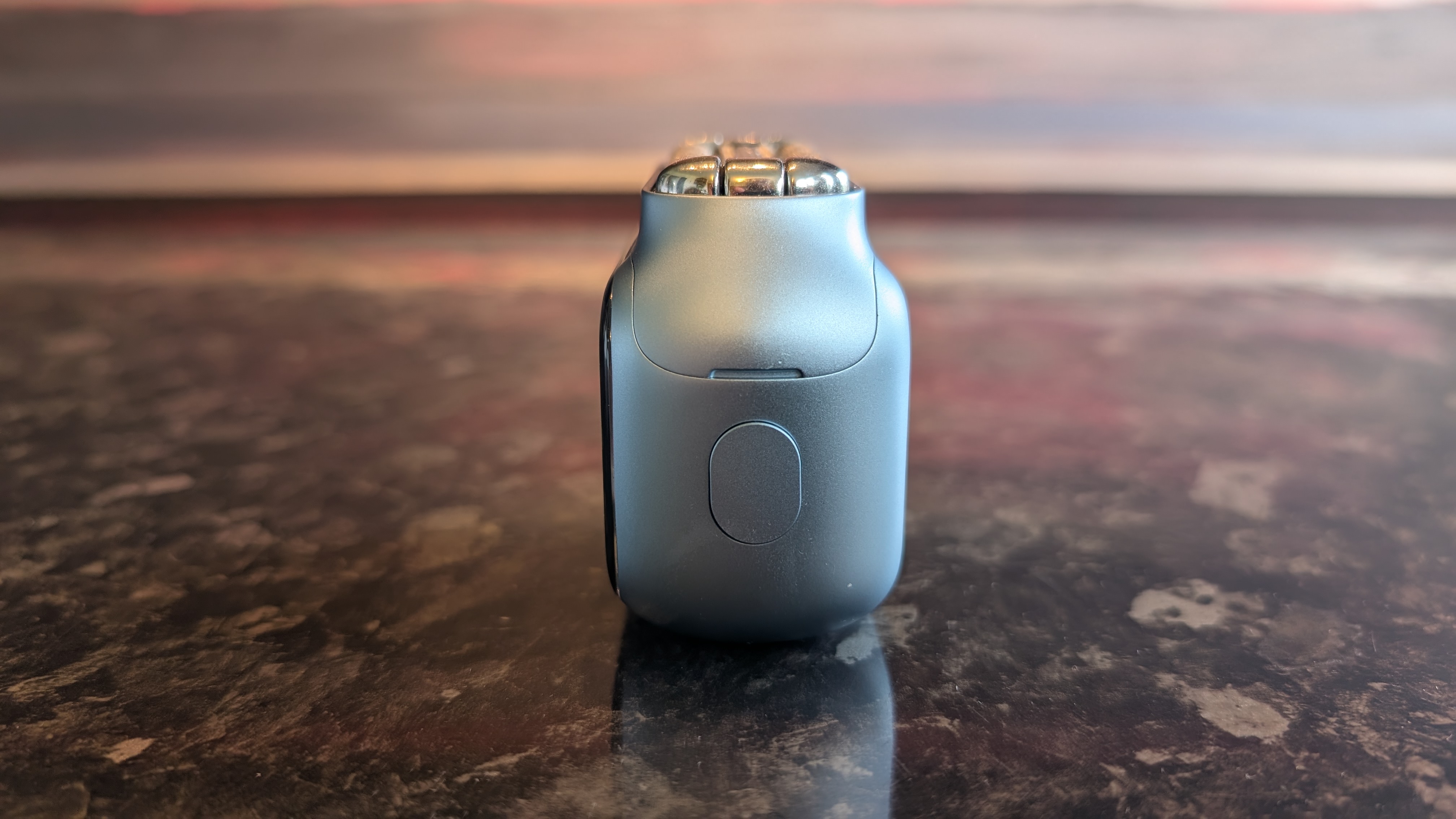 The Laifen P3 Pro electric travel shaver pictured on a dark marble worktop.