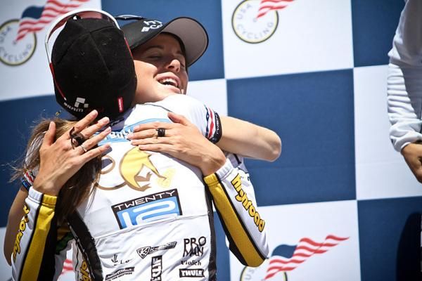 Mara Abbott and Evelyn Stevens hug on the podium.