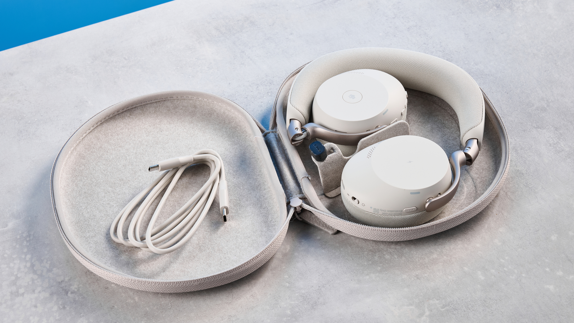 Jabras Evolve3 75 conferencing headset on a stone surface with a blue background