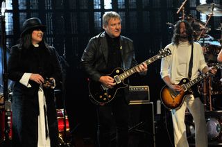 Ann Wilson, Alex Lifeson and Dave Grohl performing at the Rovk and Roll Hall of Fame induction
