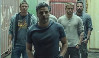 Triple Frontier Garrett Hedlund Oscar Isaac Charlie Hunnam and Ben Affleck looking into a storage co