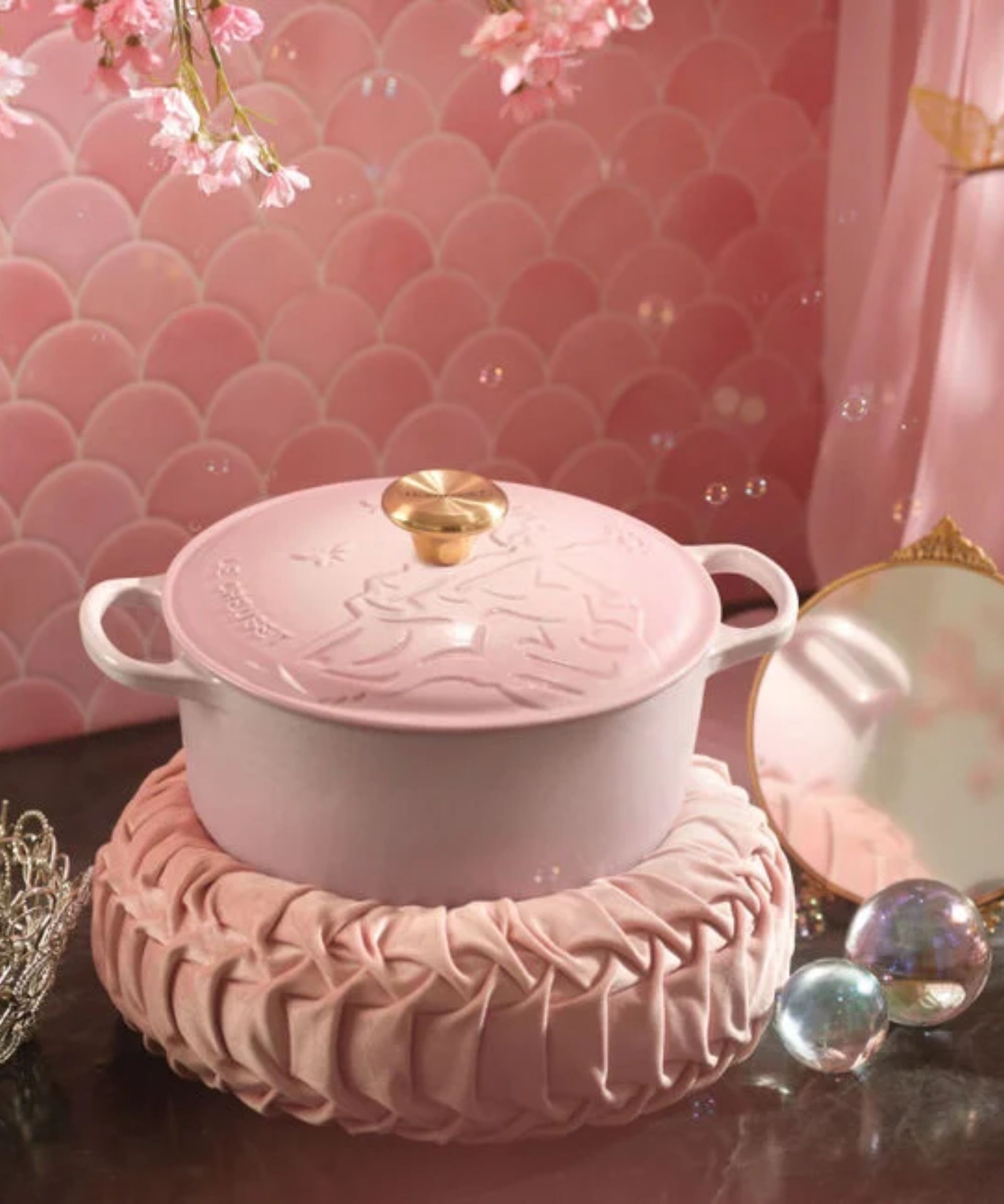 Pale pink embossed Dutch oven with gold knob