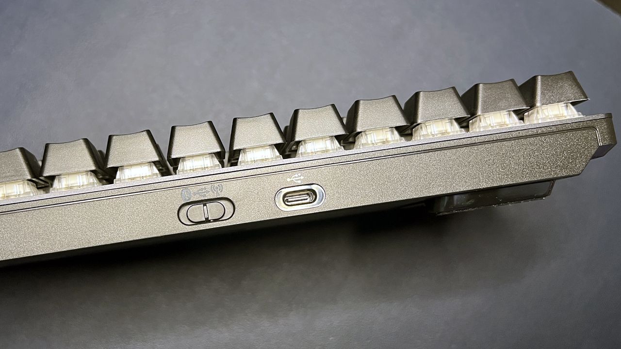 Top of ROG Strix Scope II 96 Wireless keyboard showing power switch and USB port