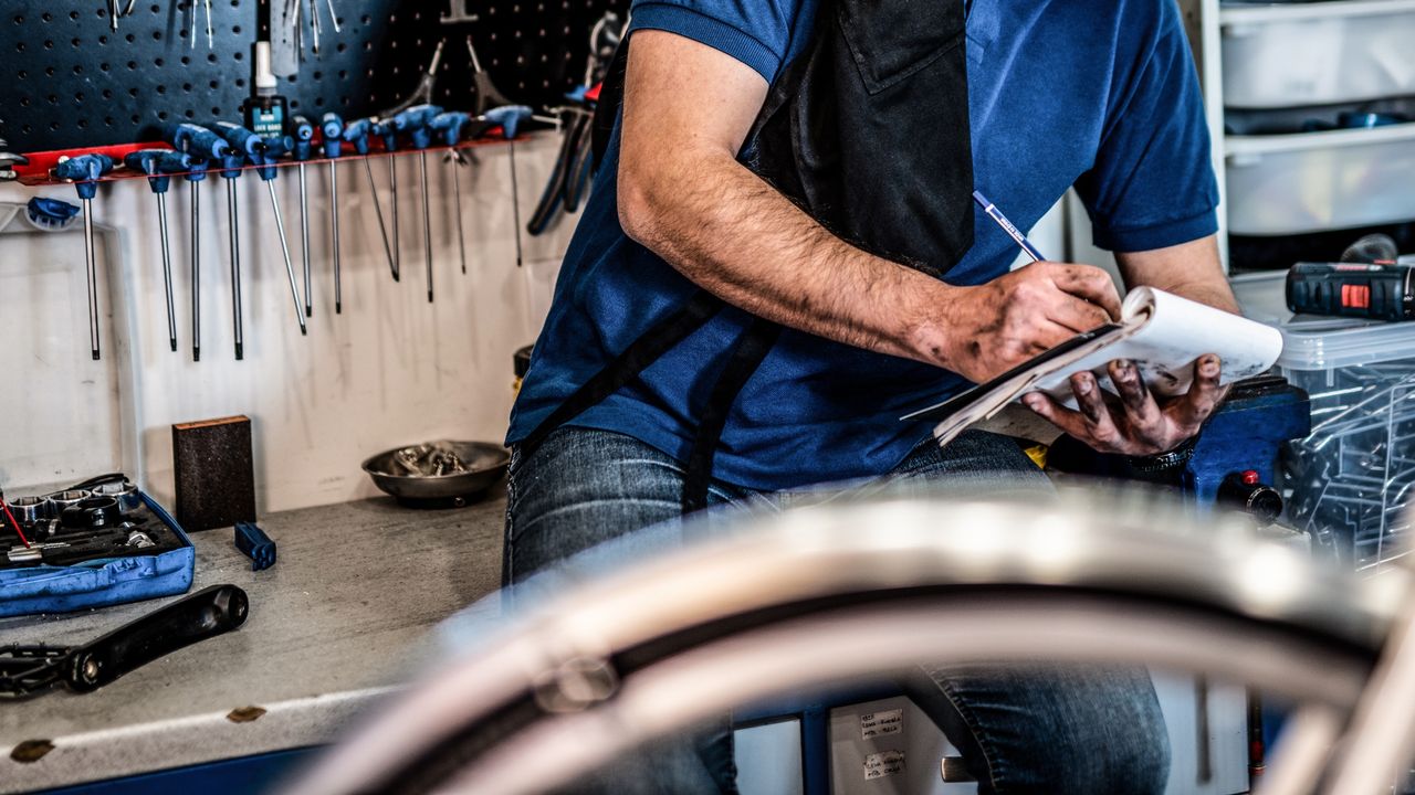 Mechanic with notebook