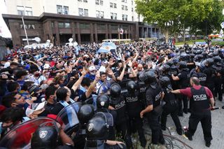 Police block fans waiting to see Diego Maradona lying in state outside the presidential palace in Buenos Aires