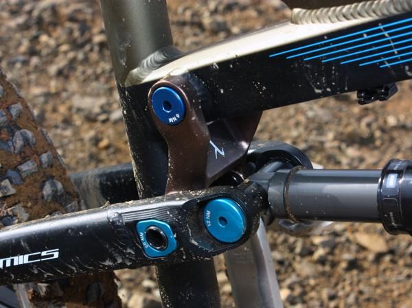 The Lambda link tweaks the leverage ratio throughout the travel range of the rear end to provide a coil-like feel but with a surprisingly stiff initial stroke that yields efficient pedaling without overly affecting small bump performance.