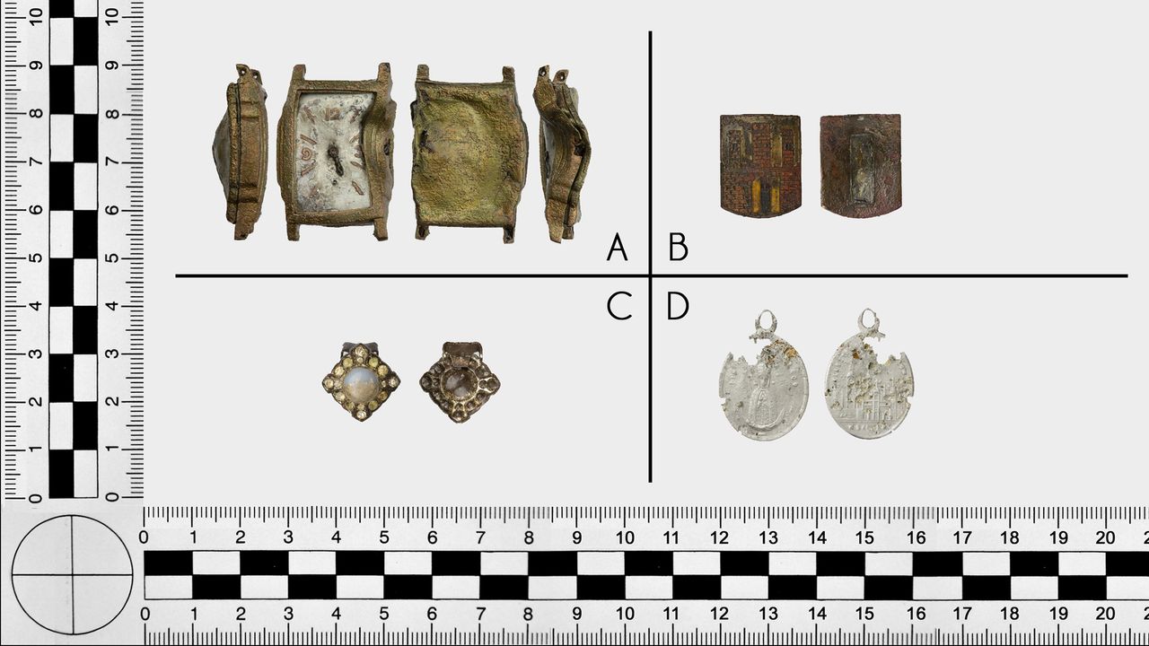 Personal belongings from victims murdered at Death Valley in 1945, including (a) a wristwatch; (b) a badge with crest of Toruń; (c) a woman's earring; and (d) a holy medal.