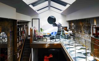 Attic library with wooden book shelves