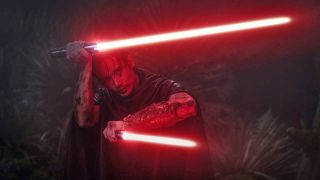 Qimir/The Stranger wields his red lightsaber and red light-dagger in The Acolyte episode 5