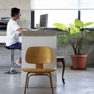 home office with chair and concrete flooring