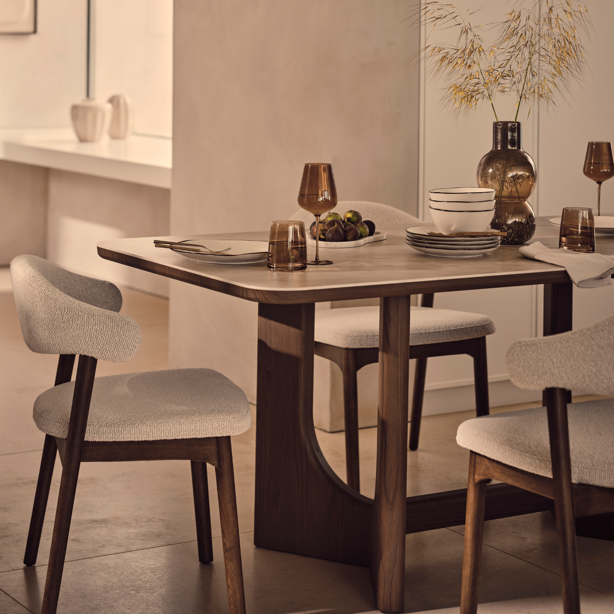 Michelle Keegan Home Esta dining table with cream boucle chairs.