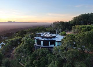 Aerial hero view of Round House by Feldman architecture among the greenery