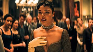 Tess Thompson walks through a crowded dancefloor