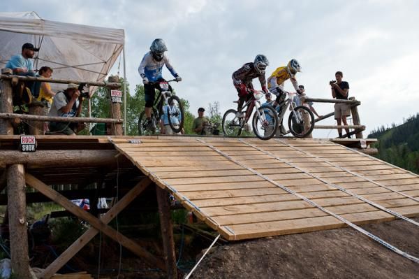 Four cross racers had a gated start with a salvaged feature from last year's race to get up to speed.