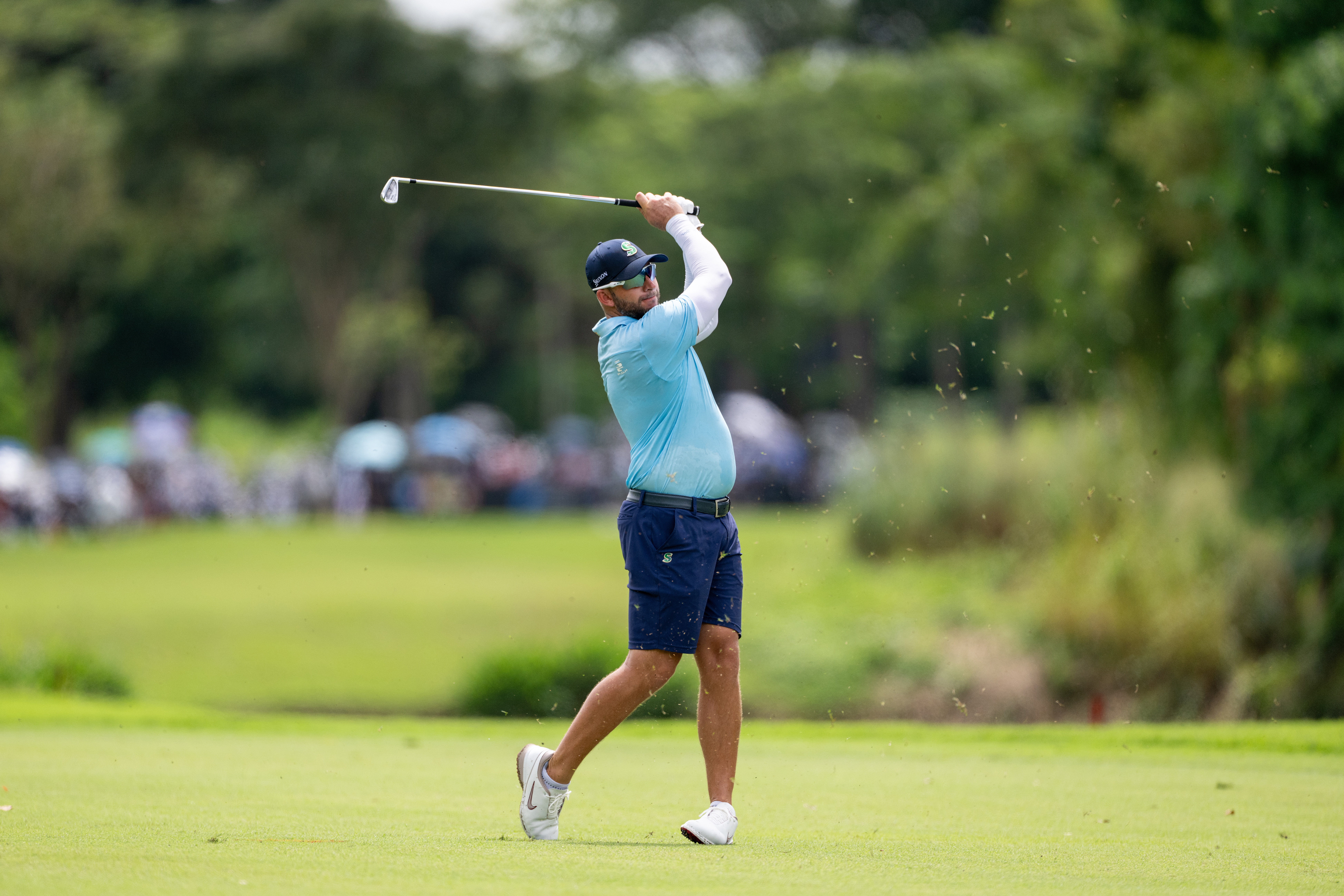 Dean Burmester holds his finish on an iron shot during an Asian Tour event