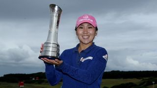 I K Kim with the Women's Open trophy