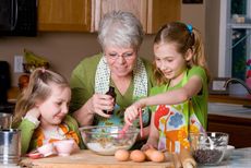 Grandma baking with grandkids.