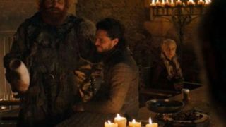 A scene from Game of Thrones with a coffee cup clearly visible on a table