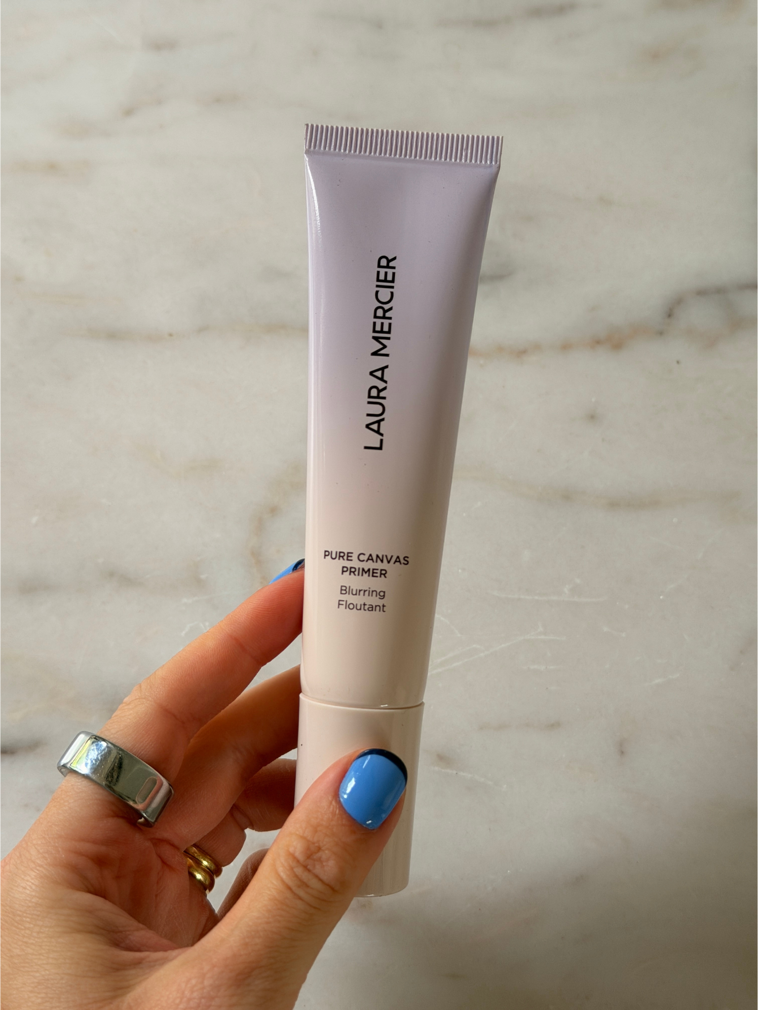 Grace holding the Laura Mercier primer