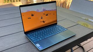 A Lenovo Yoga Slim 9i playing a game