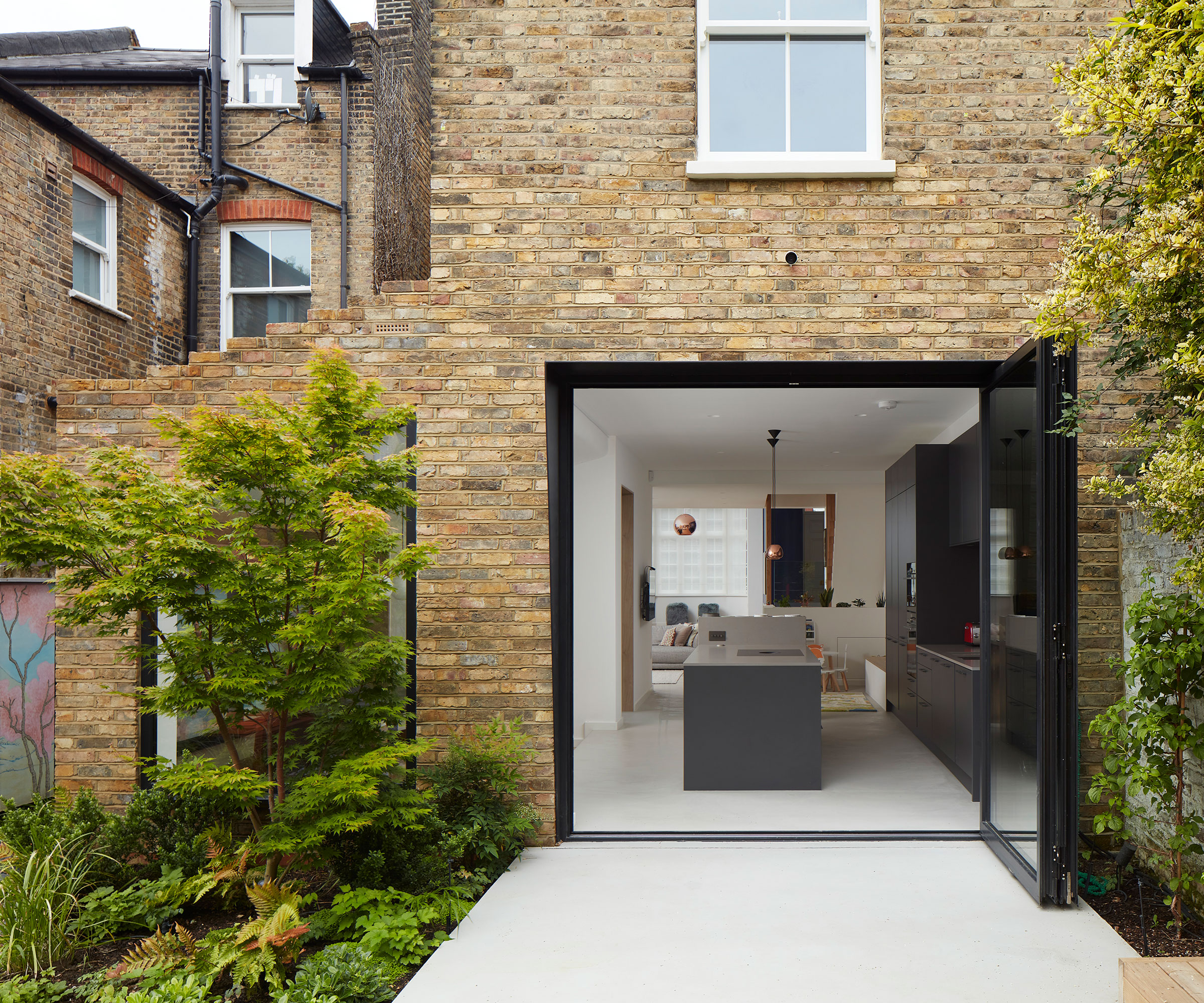 kitchen side extension with stepped roofline and bifold doors